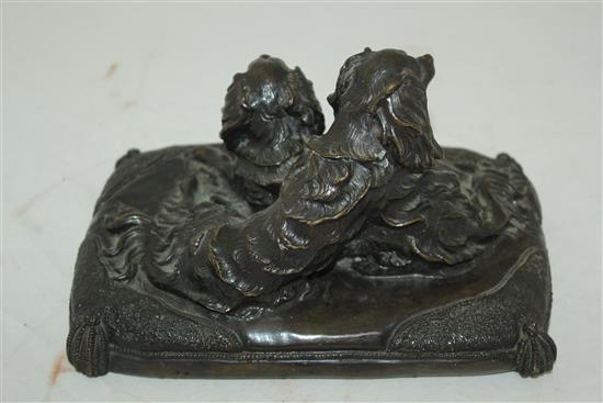 A late 19th / early 20th century patinated bronze group modelled as two spaniels, 8.5in.